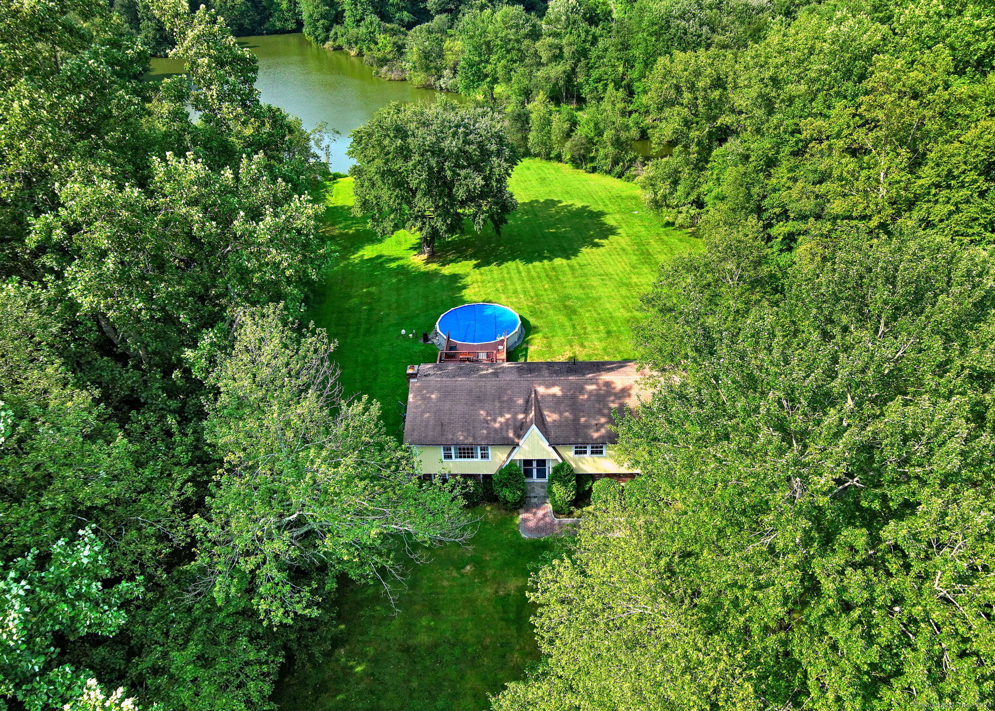 a aerial view of a house with a yard