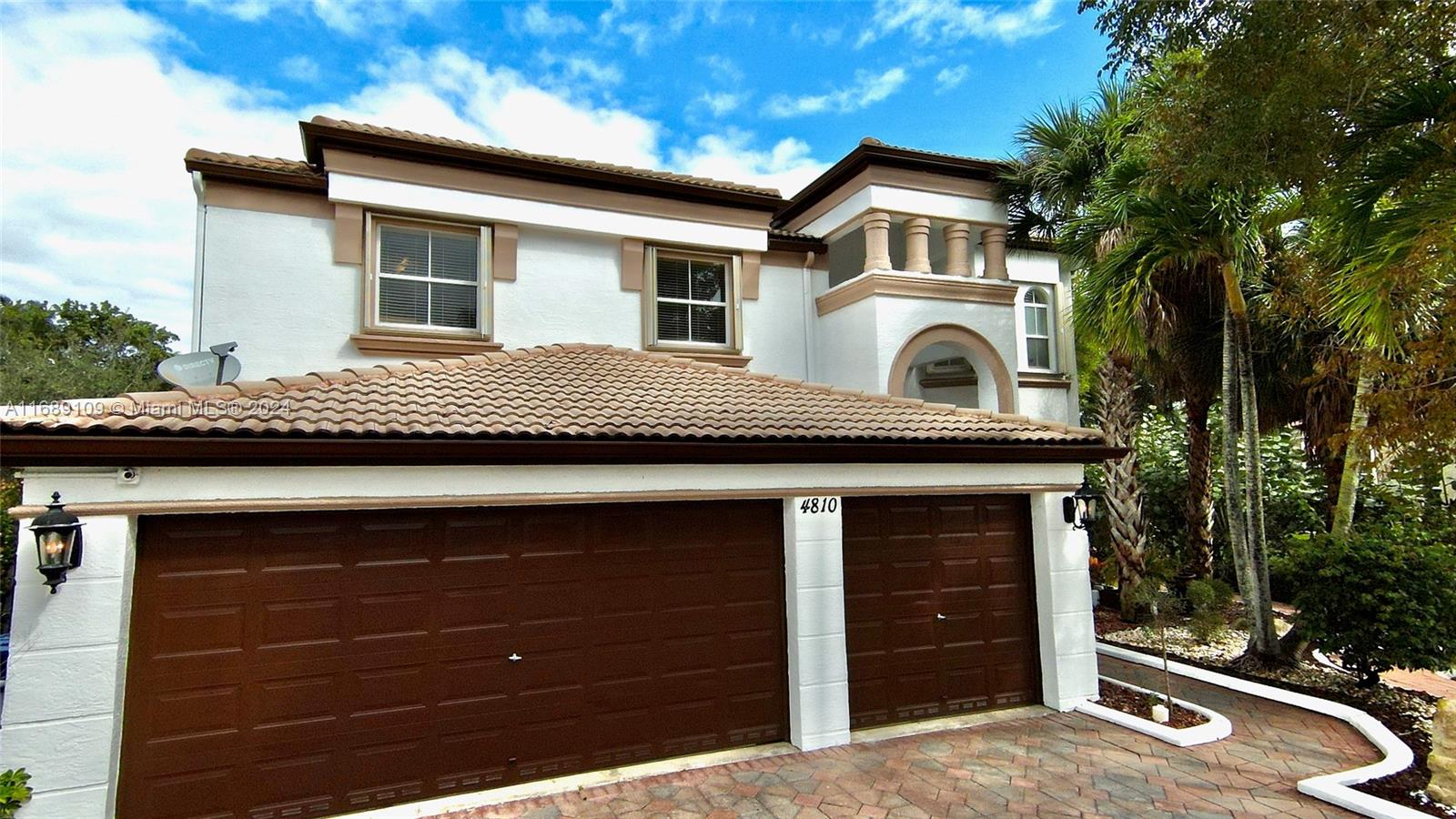 a front view of a house with a garage