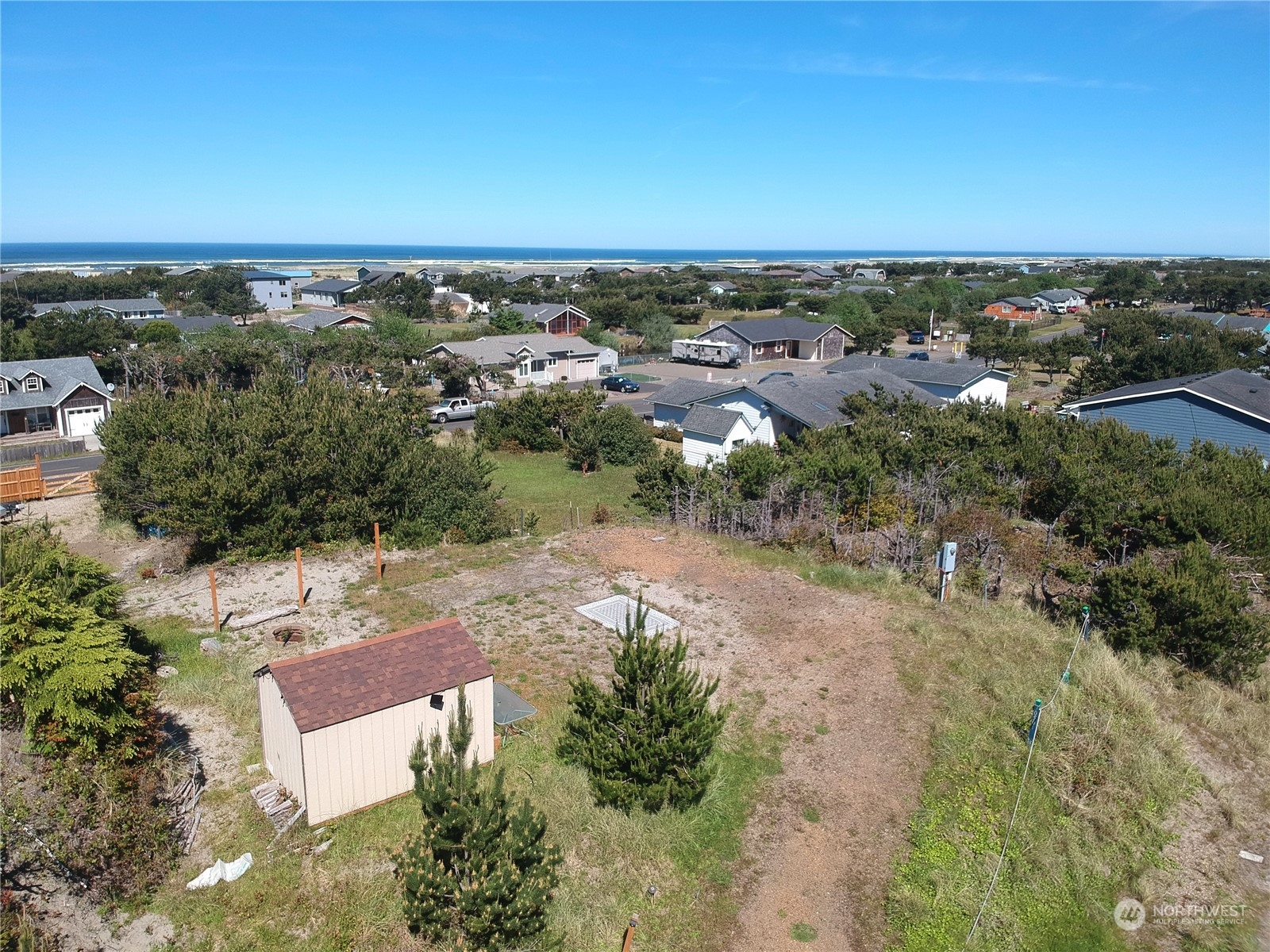 an aerial view of a houses with a yard