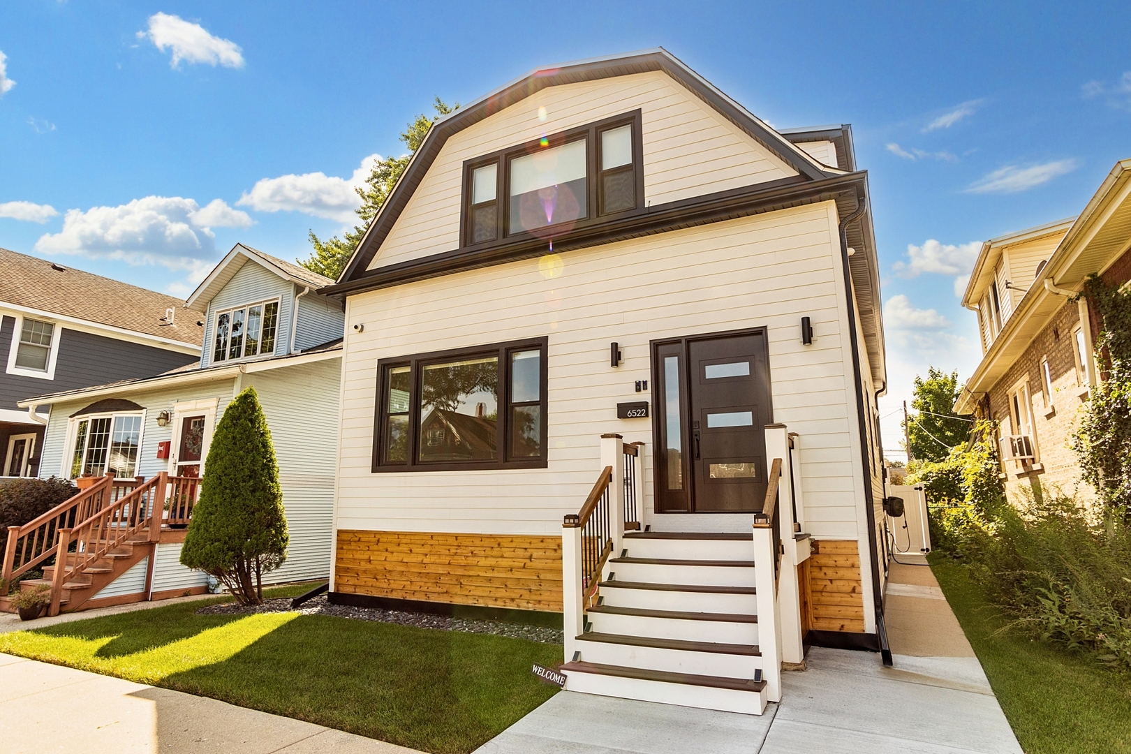 a front view of a house with a yard