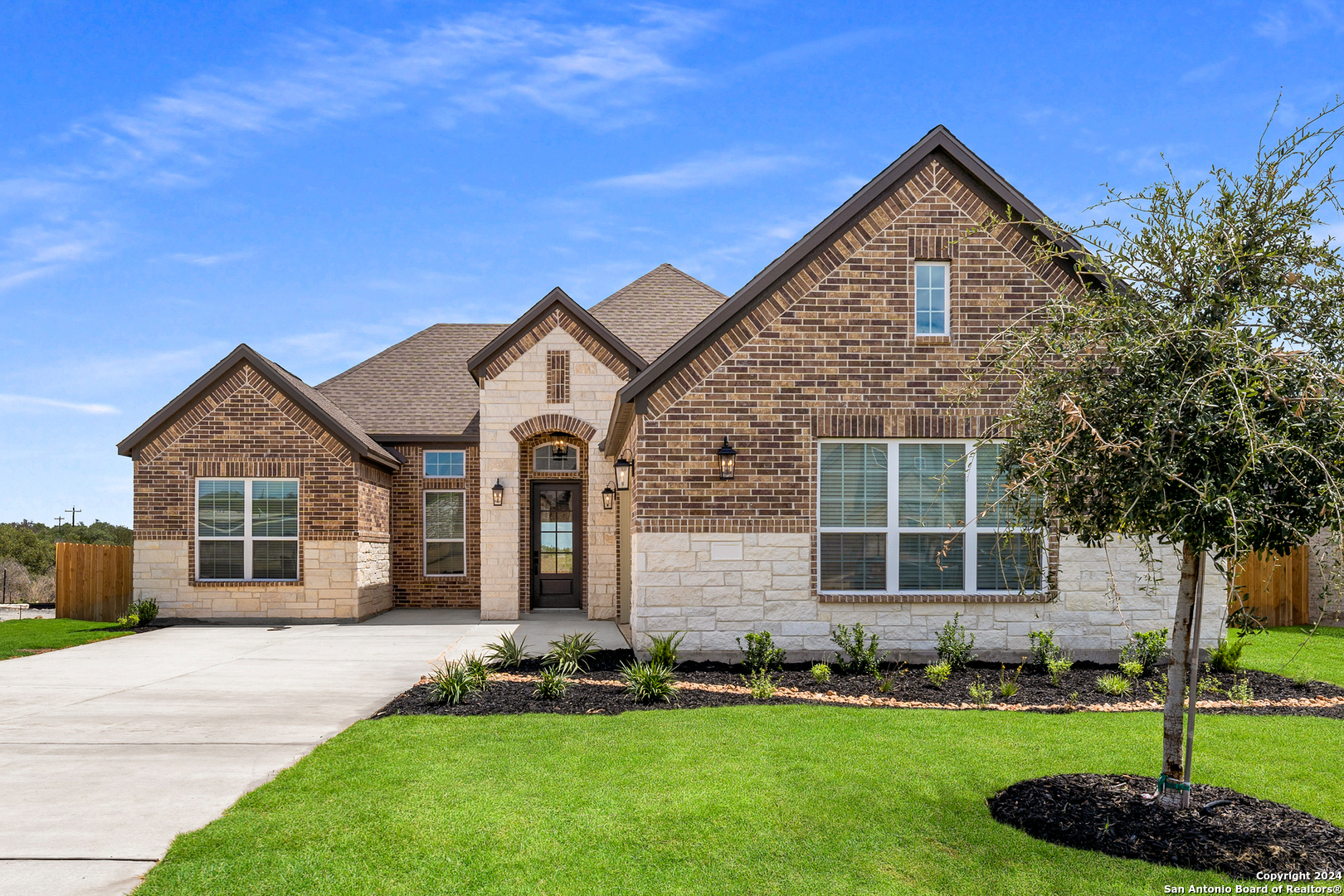 front view of a house with a yard