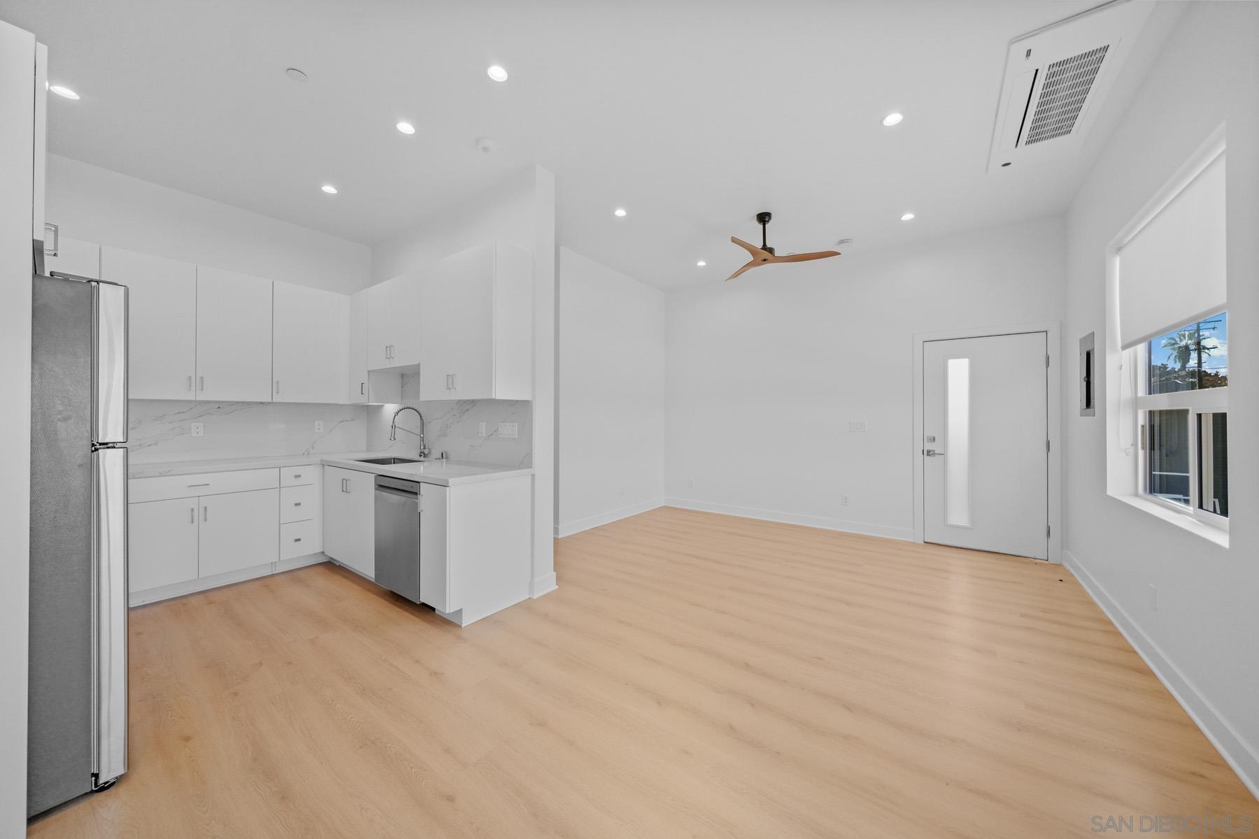 a view of a kitchen with electric appliances