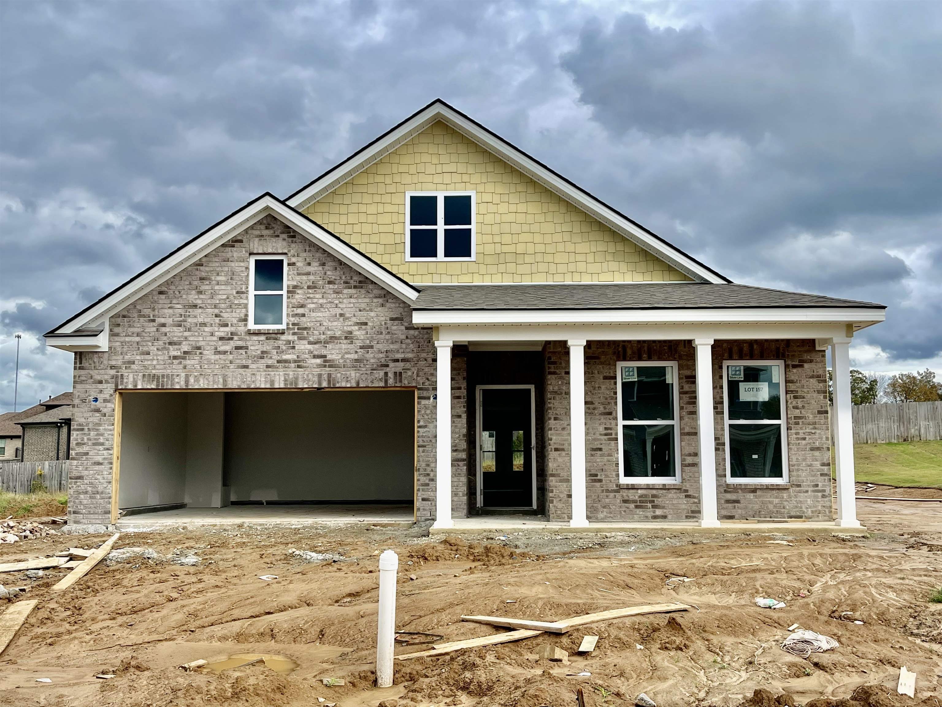 a front view of a house with a garage