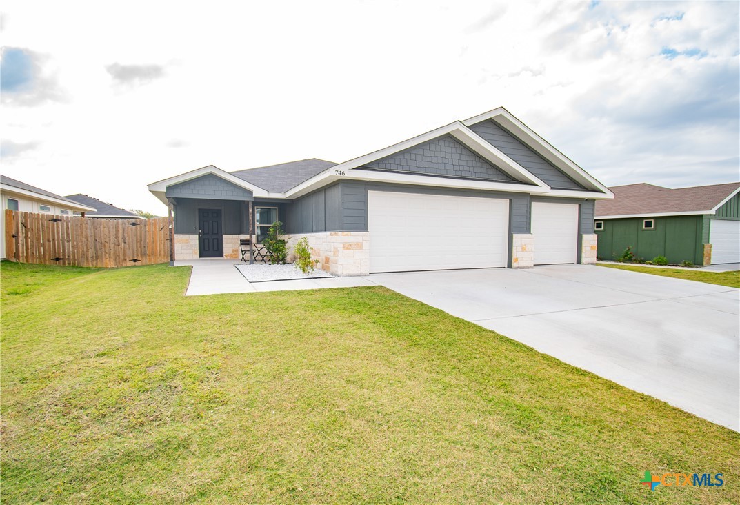 a front view of house with yard and seating area