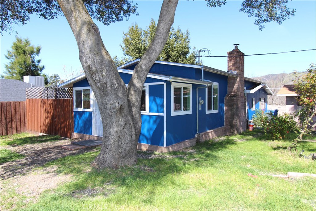 a view of house with yard