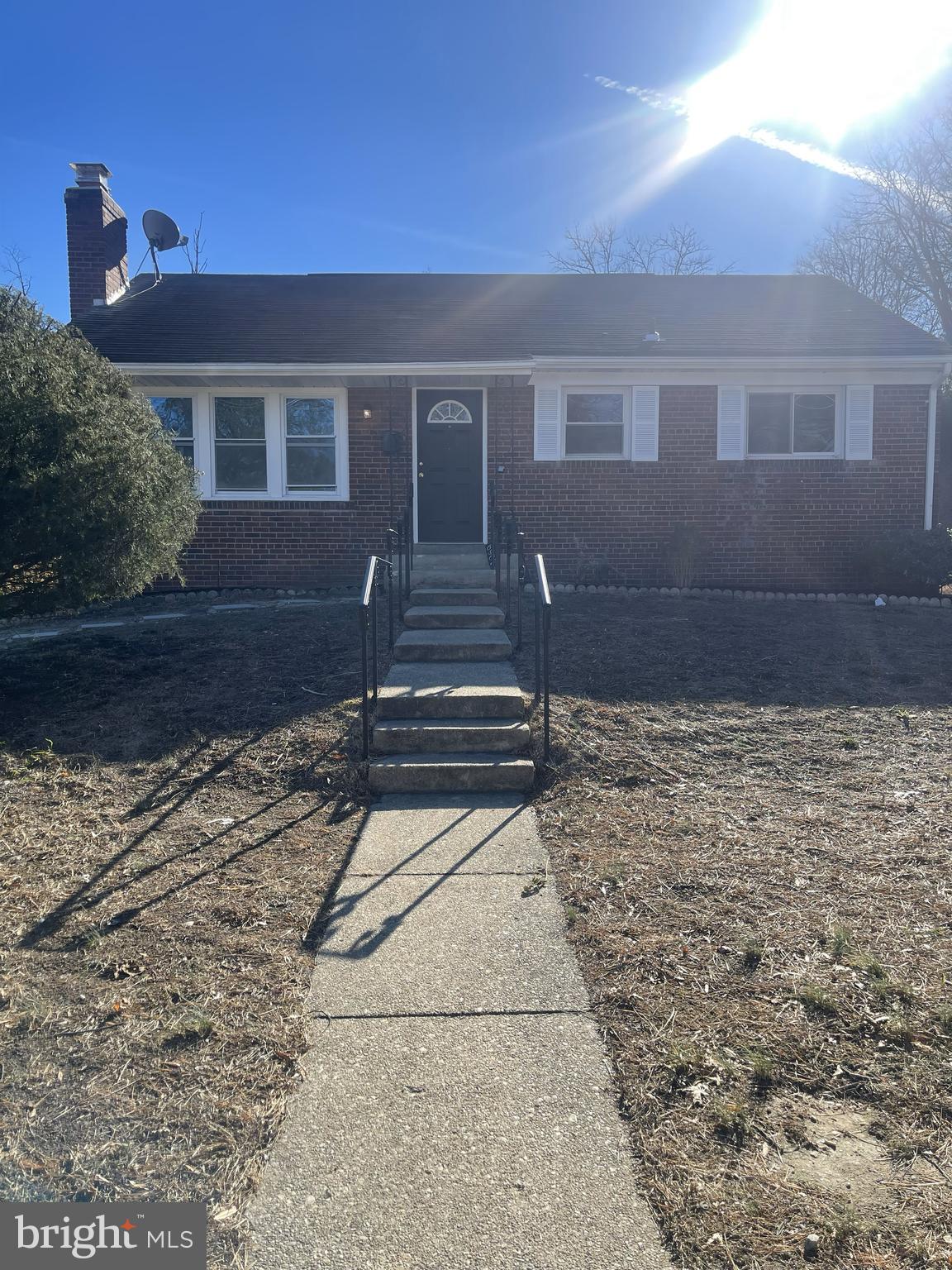 a view of house with backyard