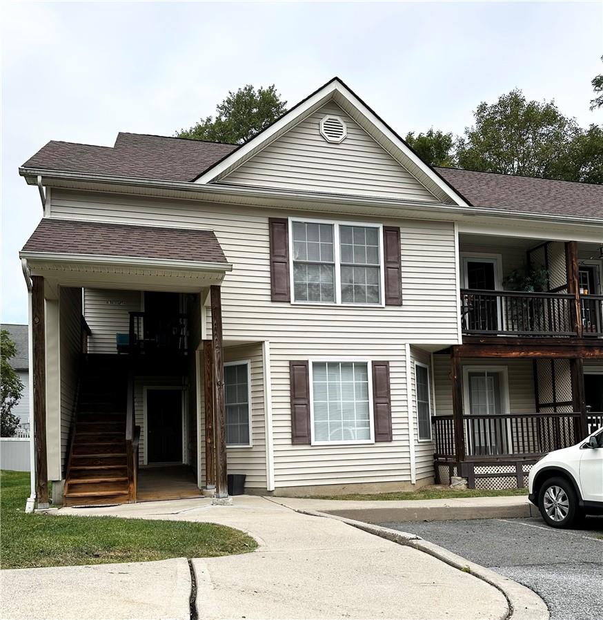 View of front of property featuring a balcony