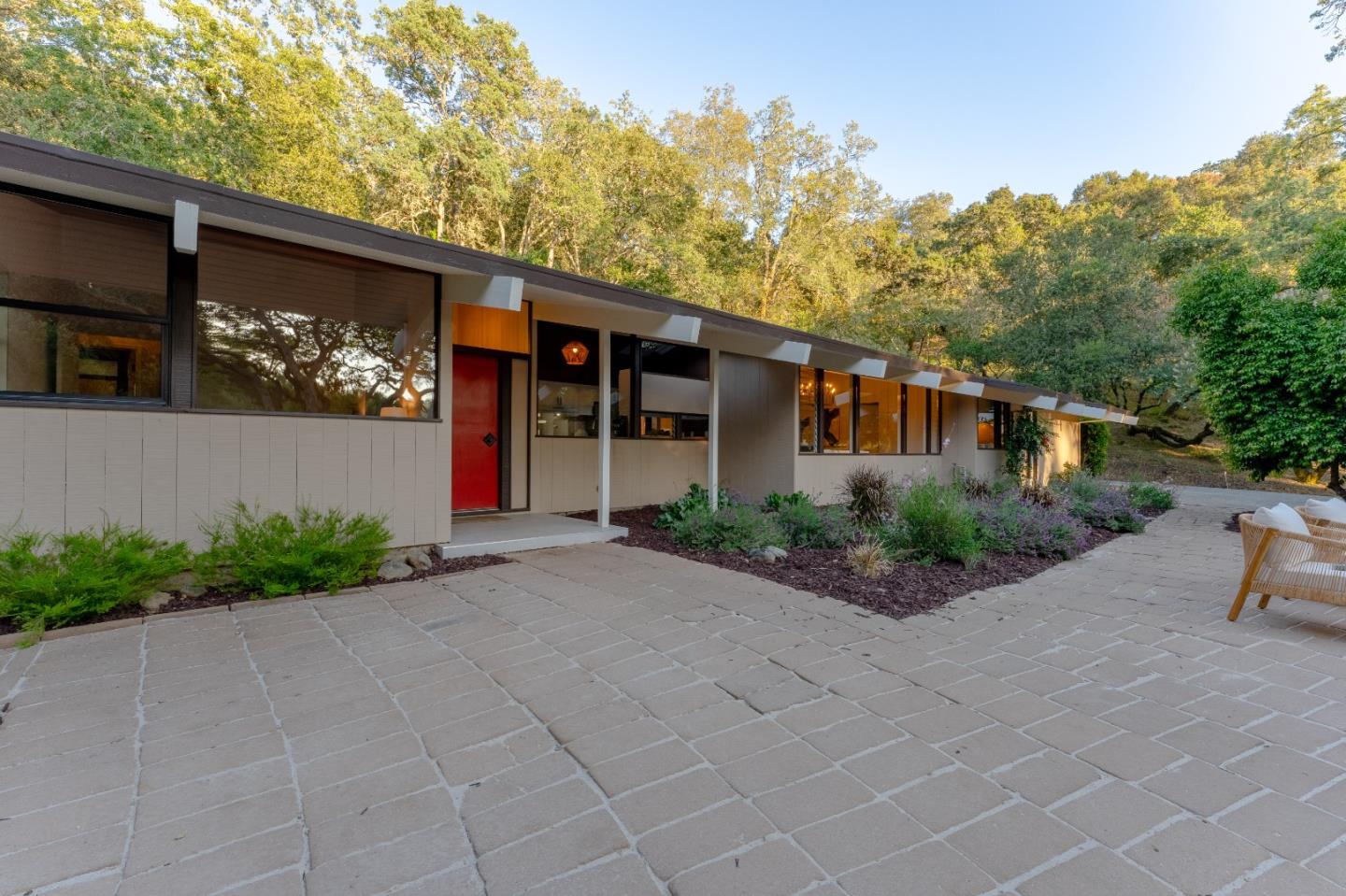 a front view of a house with garden