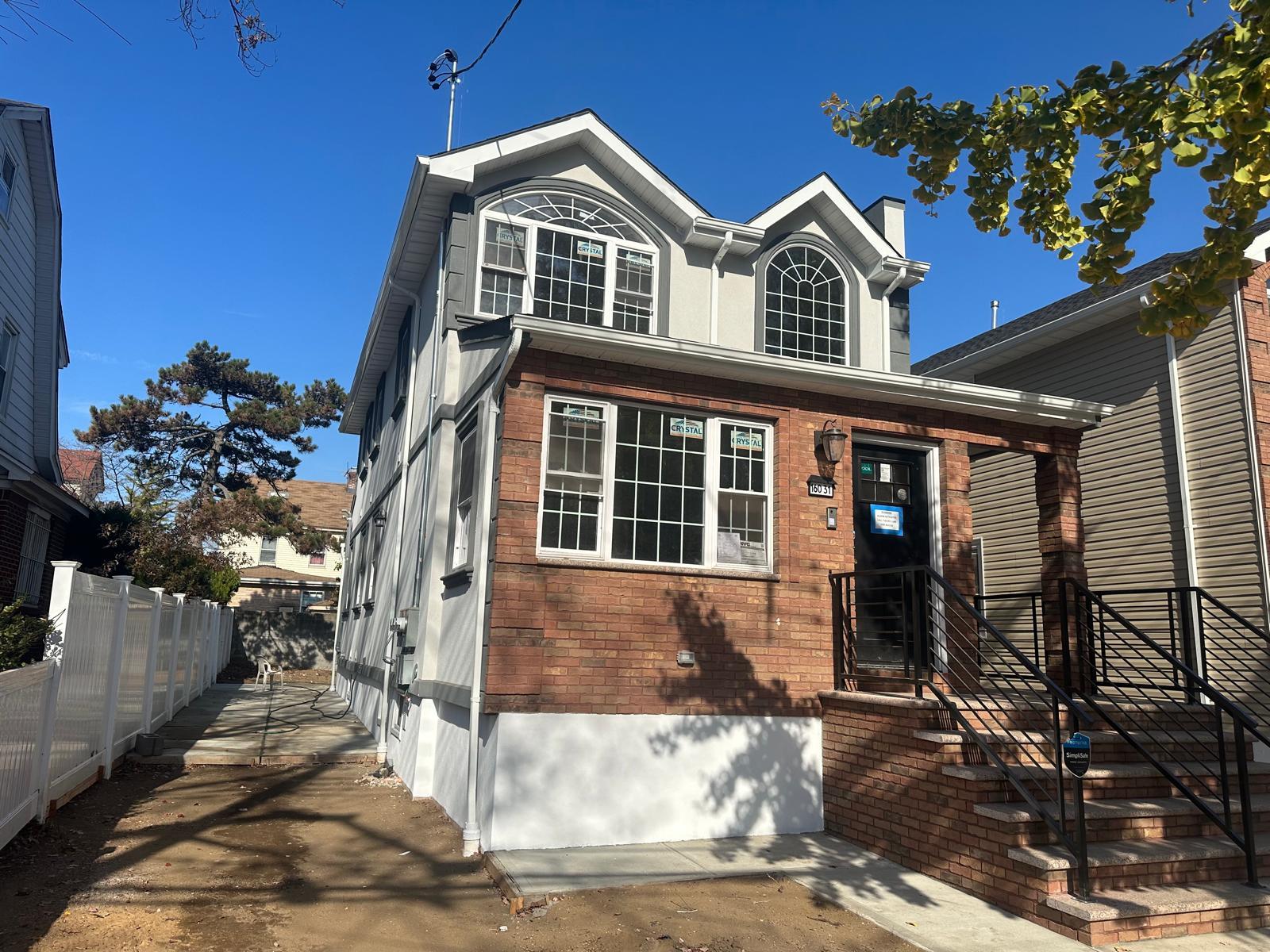 a front view of a house with a porch