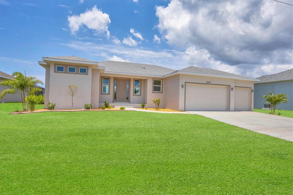 a view of a house with a backyard