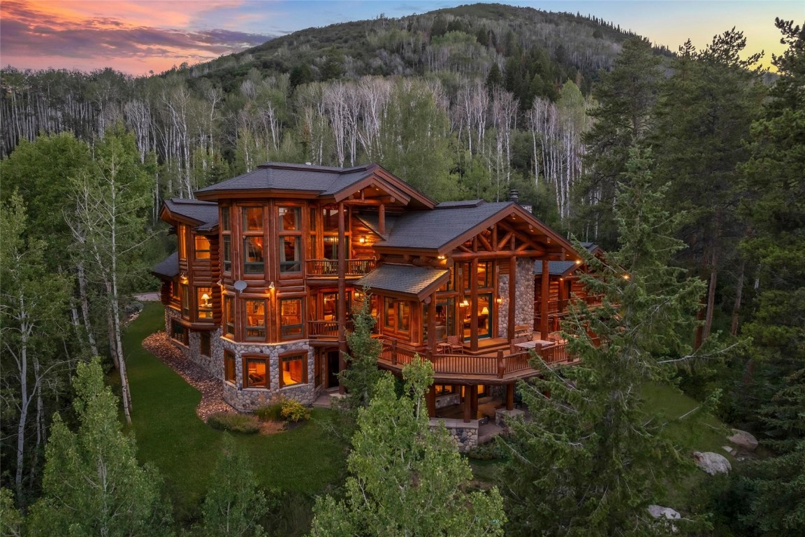 an aerial view of a house with a yard