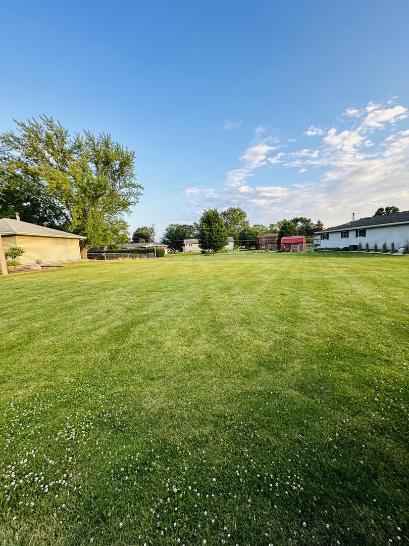 a view of an ocean and a yard