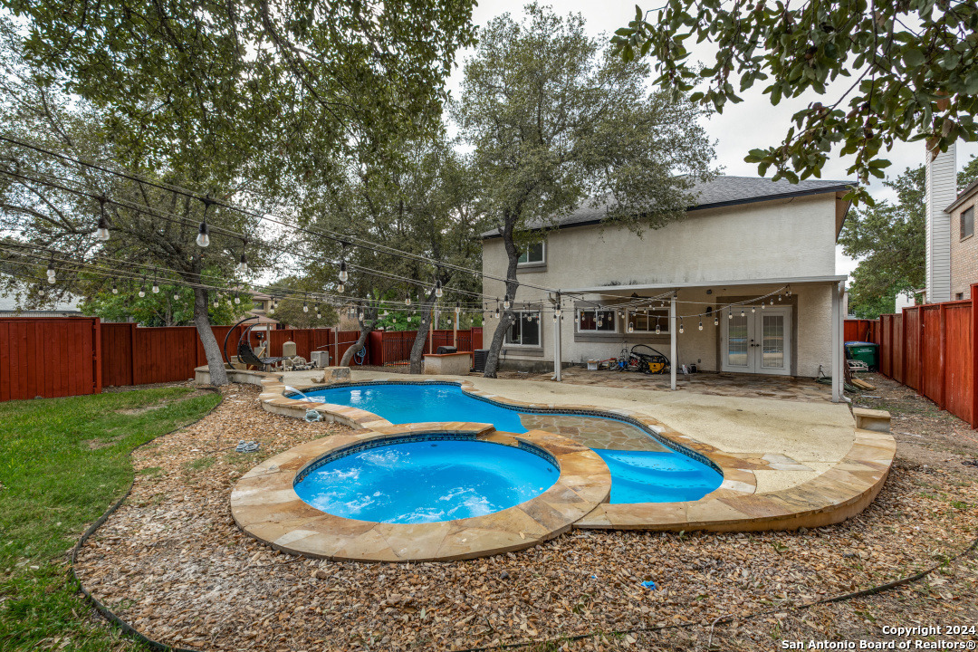 a view of a swimming pool with a sitting space