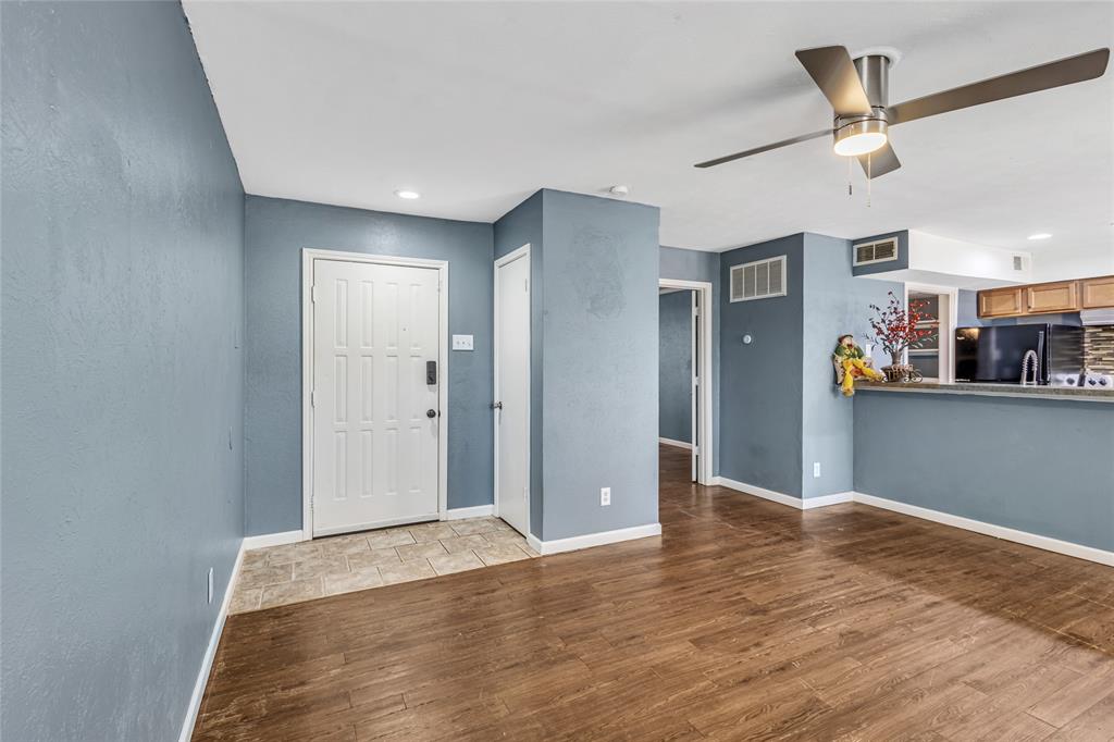 a view of a livingroom with wooden floor