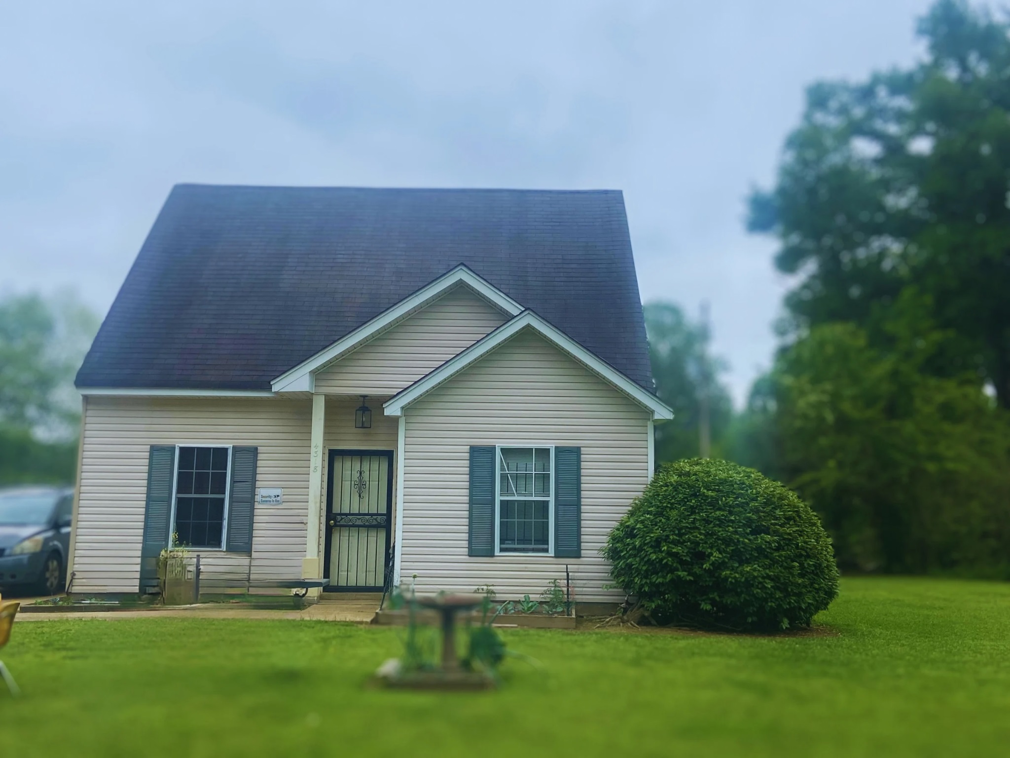 a front view of a house with a yard and yard