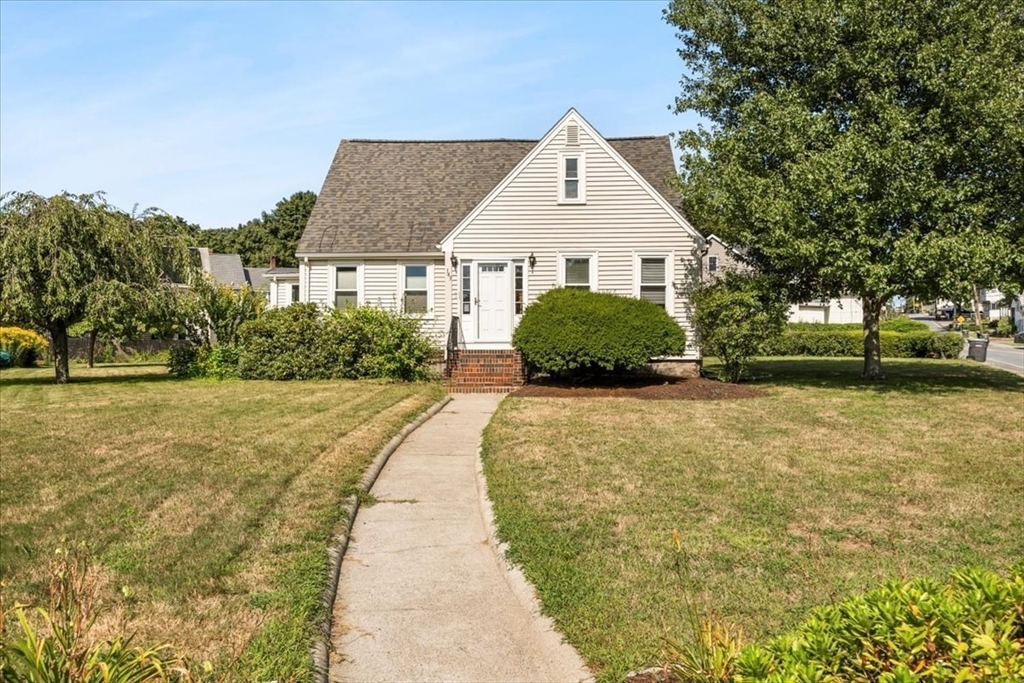 a front view of a house with a yard