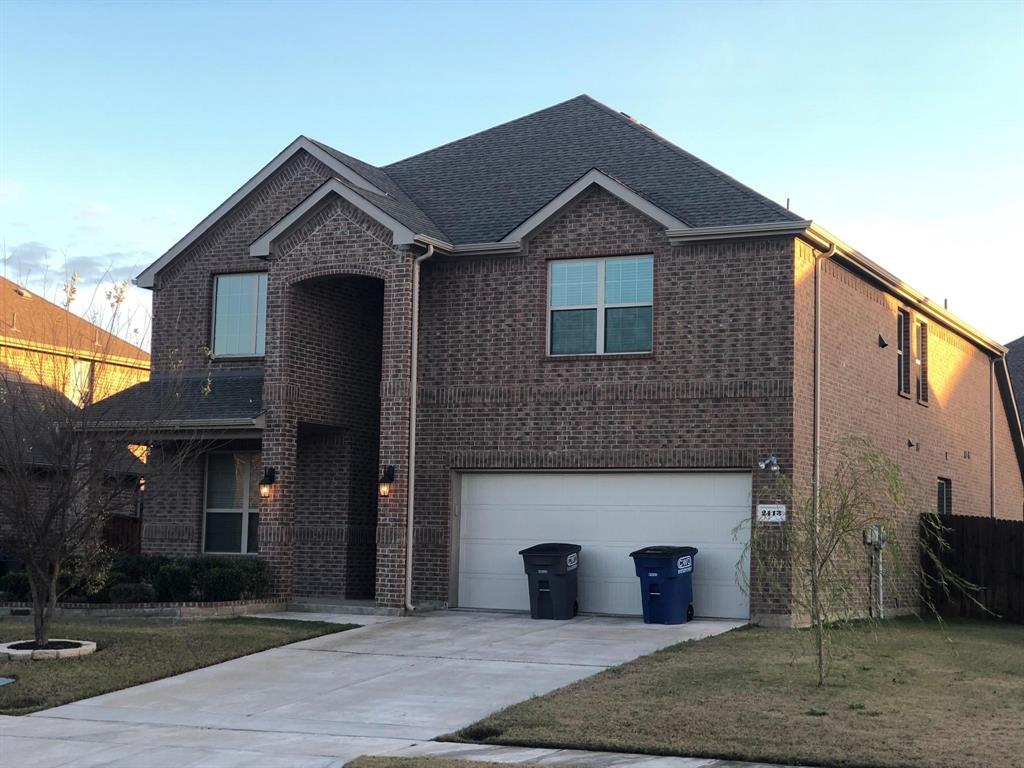 a front view of a house with yard