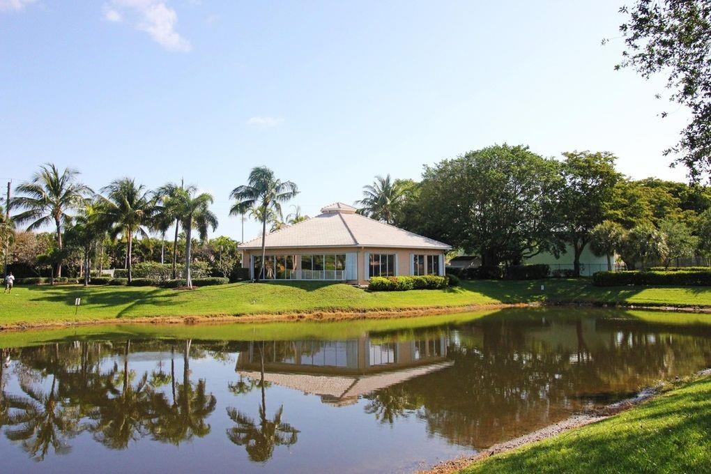 a view of a house with swimming pool and a yard