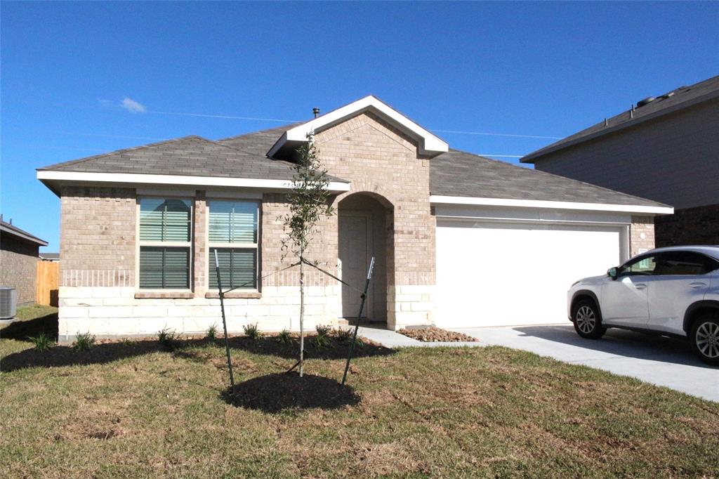 a front view of a house with parking space