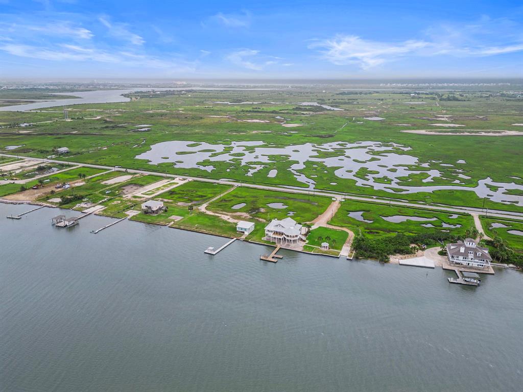 RARE opportunity on one of Galveston's best kept bayfront secrets, Sportsman Road.