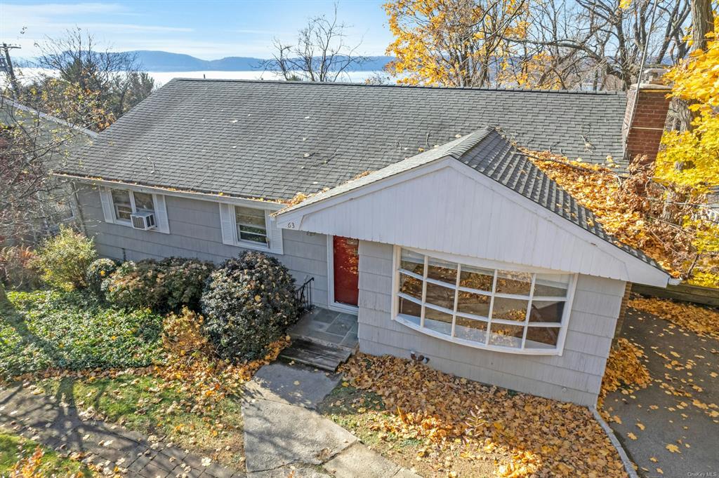 Welcome to 63 Cedar Lane, Ossining featuring Hudson River views from the rear windows and private Deck!