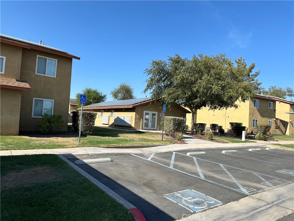 a view of a house with a yard and street view