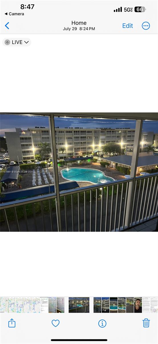 a view of swimming pool with outdoor seating