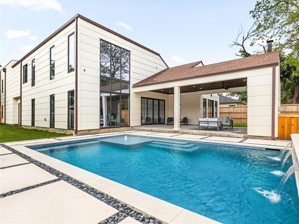 a view of swimming pool with outdoor seating