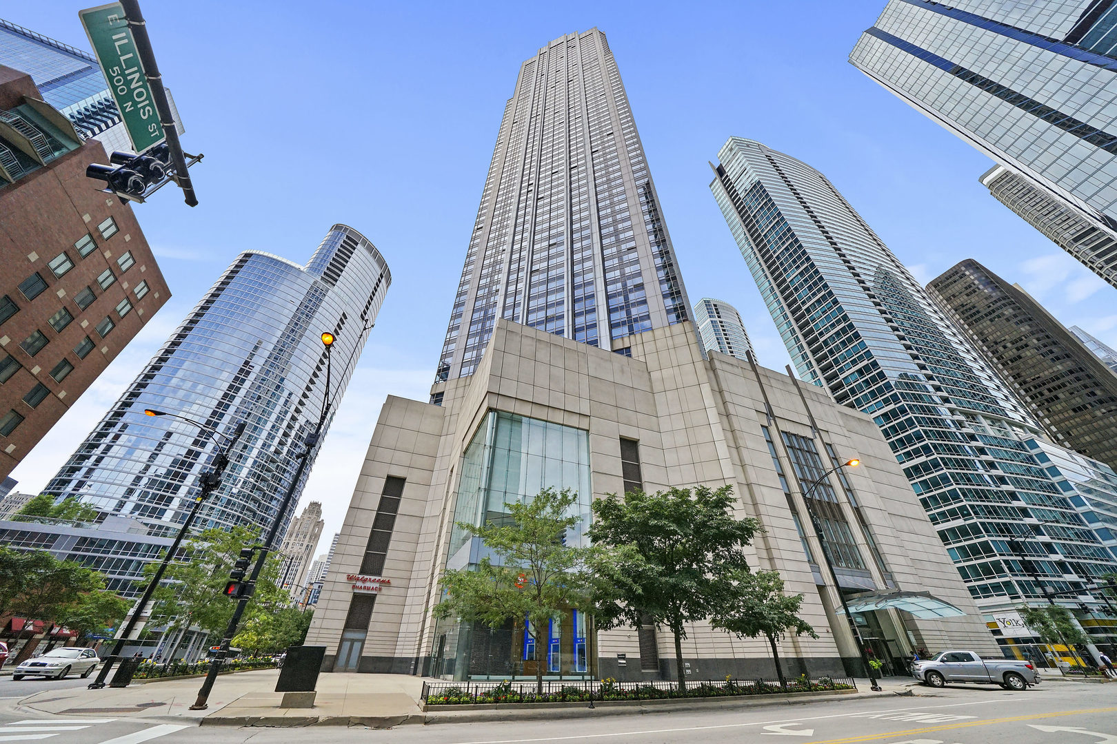 a view of a tall building next to a road