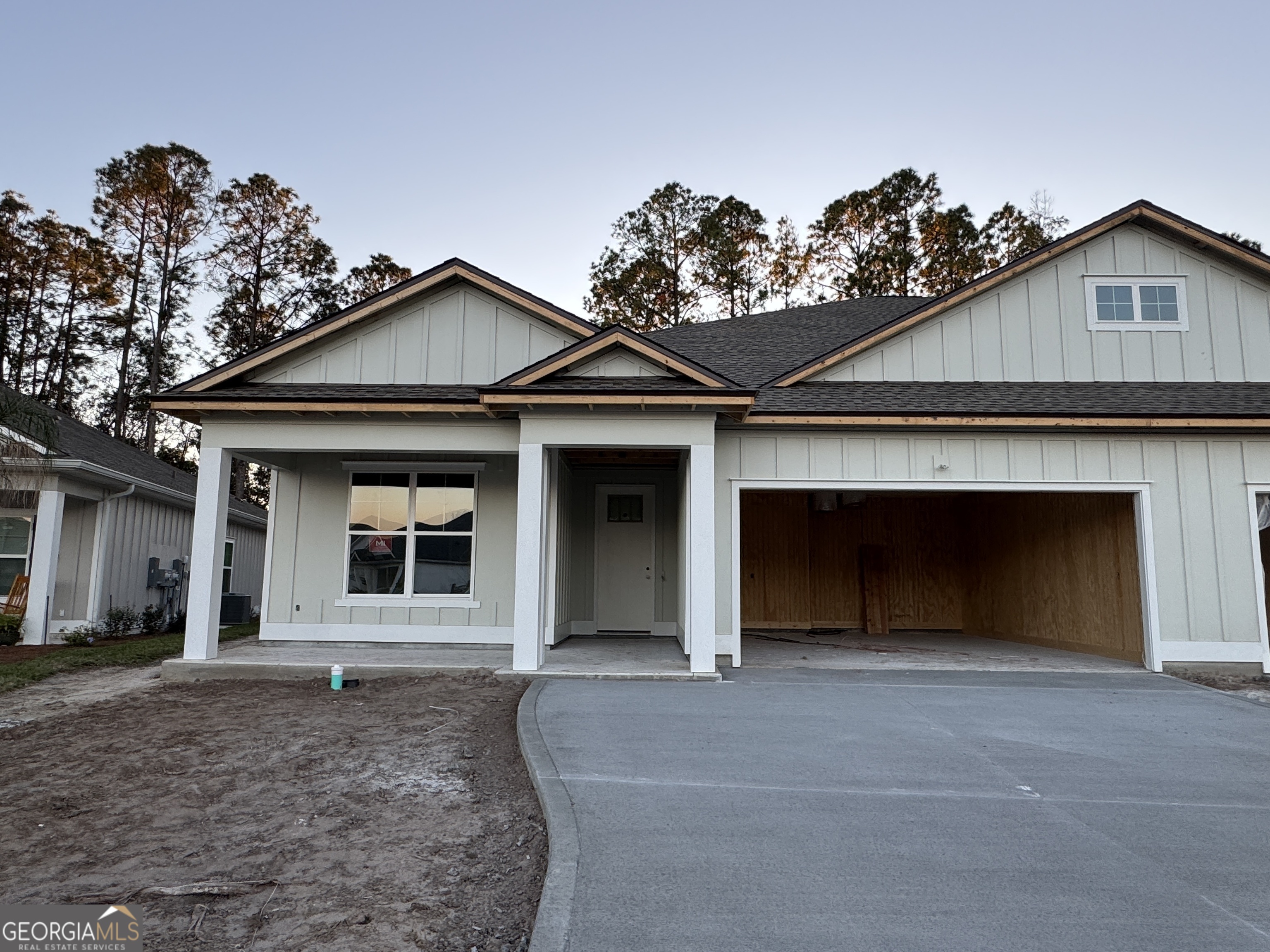 a front view of a house with a garage