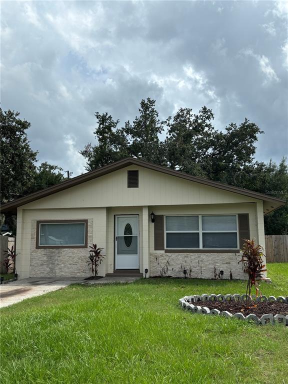 a front view of house with yard and green space