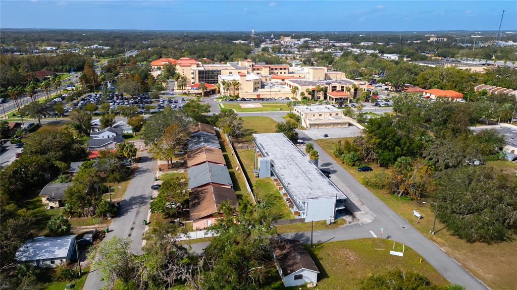 an aerial view of residential houses with outdoor space