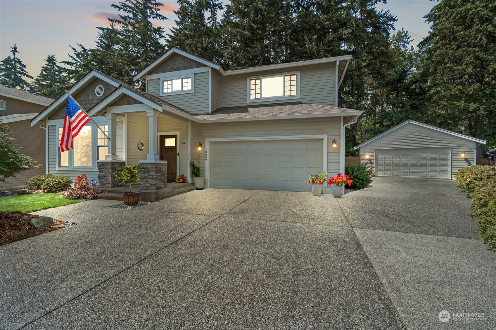 a view of a house with a yard and garage