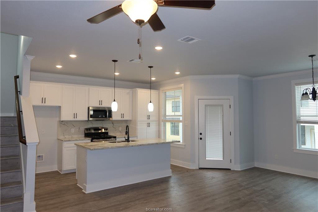 Kitchen with a healthy amount of sunlight, pendant