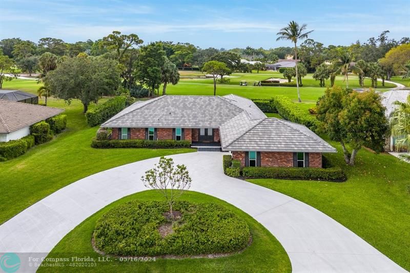 an aerial view of a house with garden