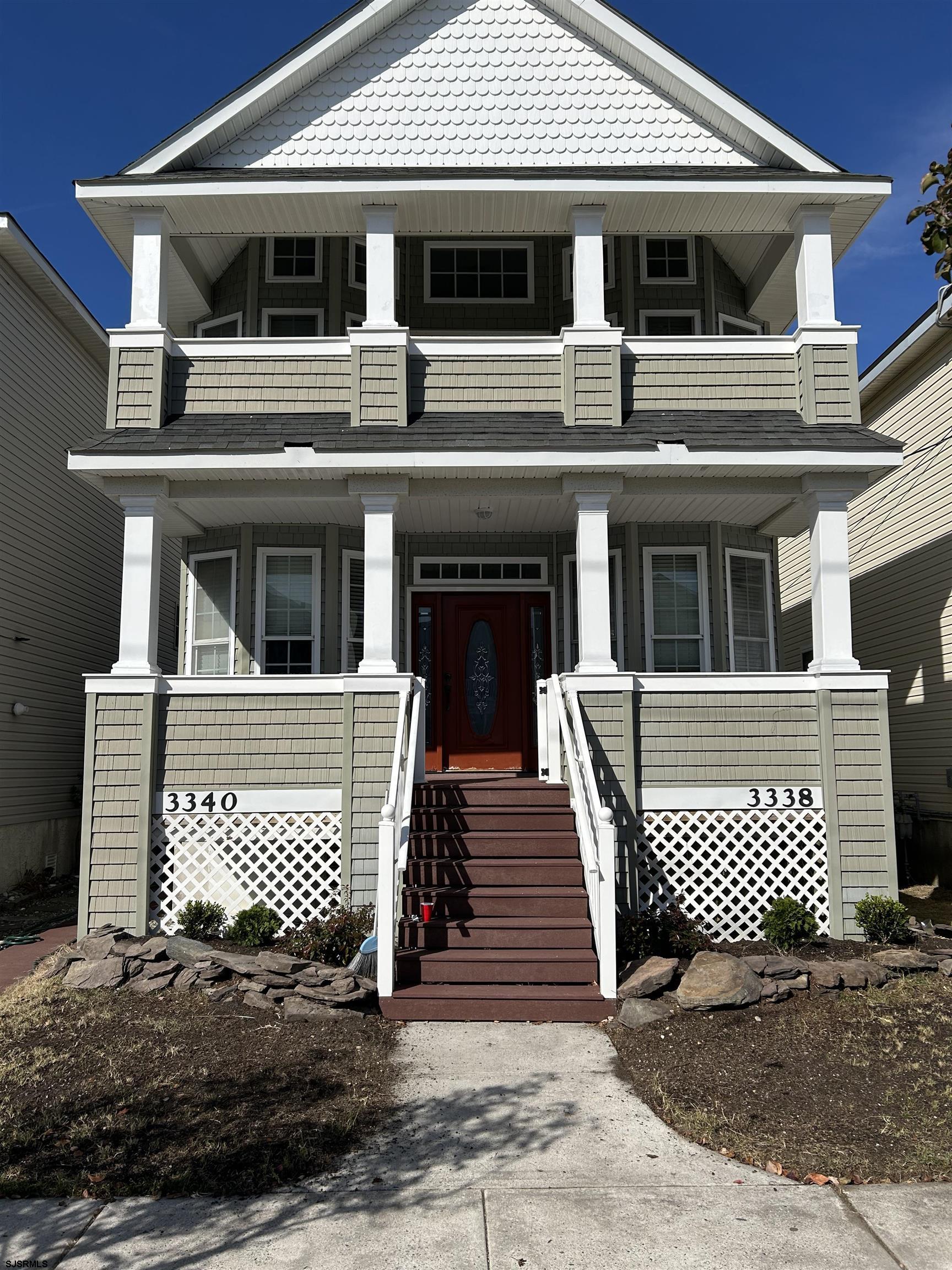 a front view of a house with garage