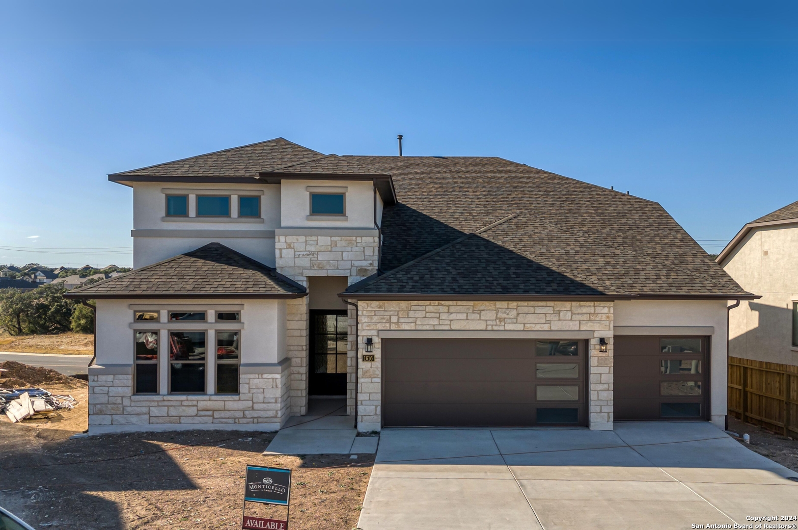 a front view of a house with a yard