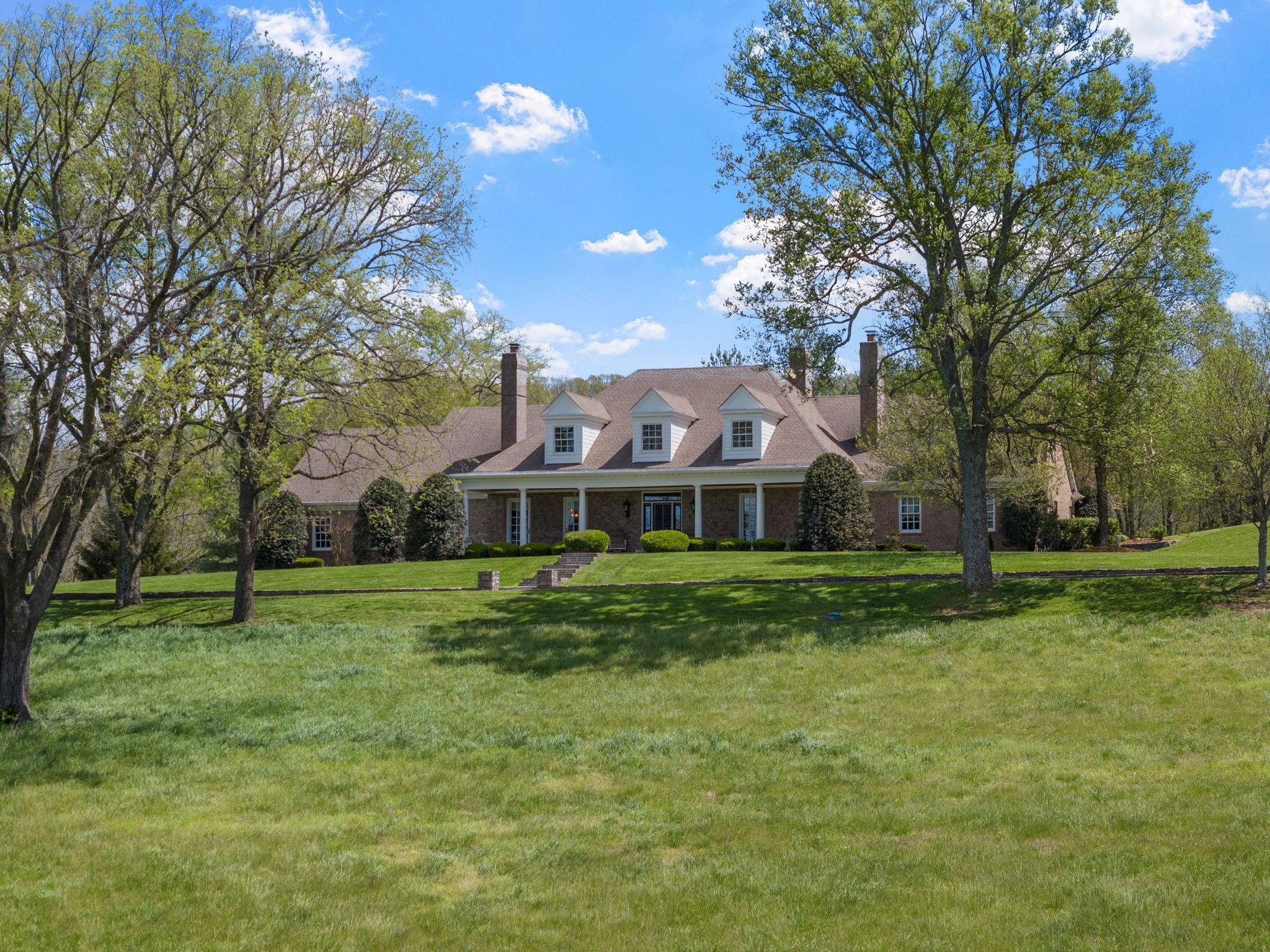 a view of a house with a big yard