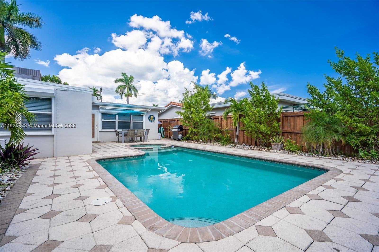 a view of a house with swimming pool