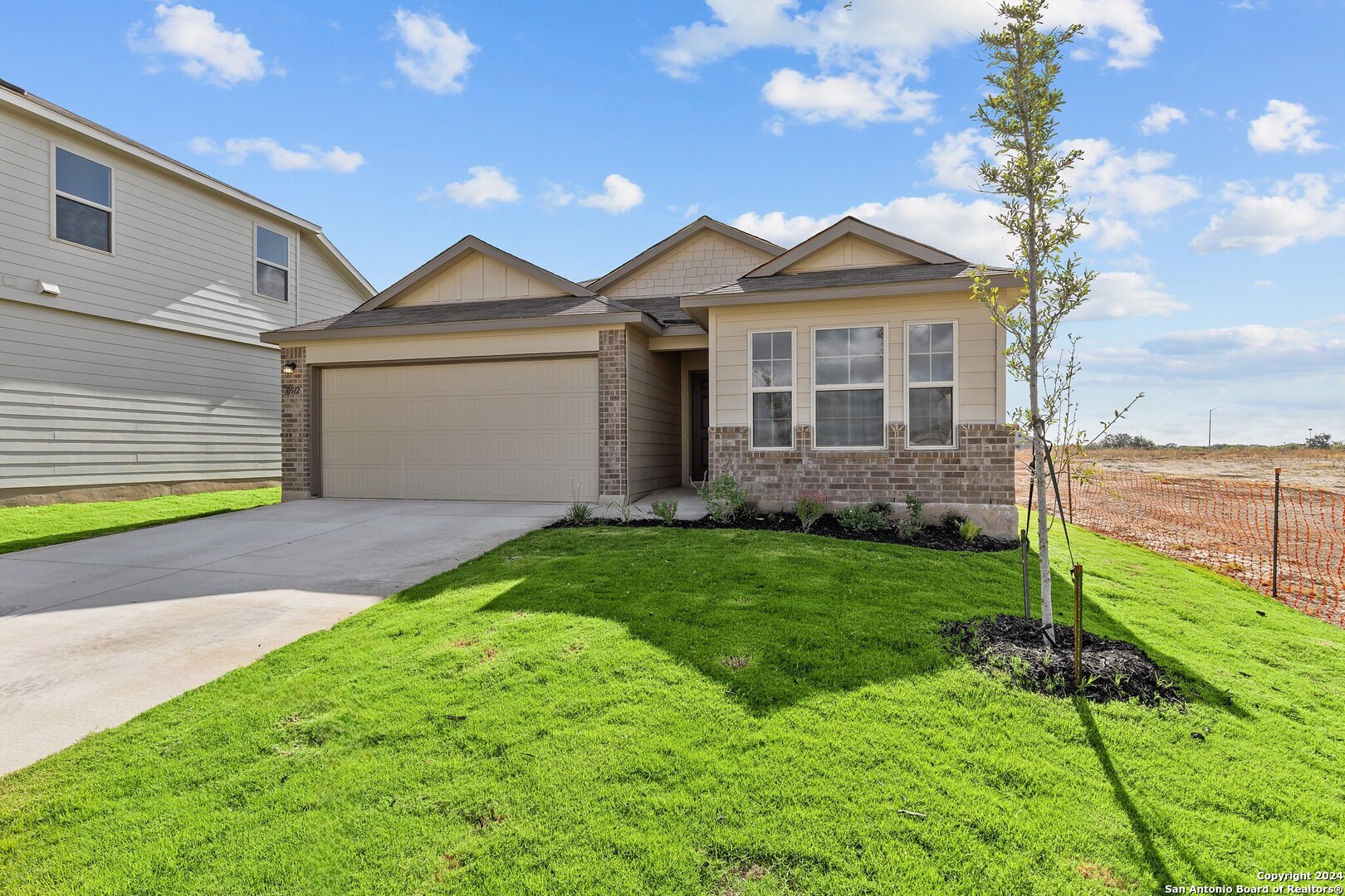 a view of a front of a house with a yard