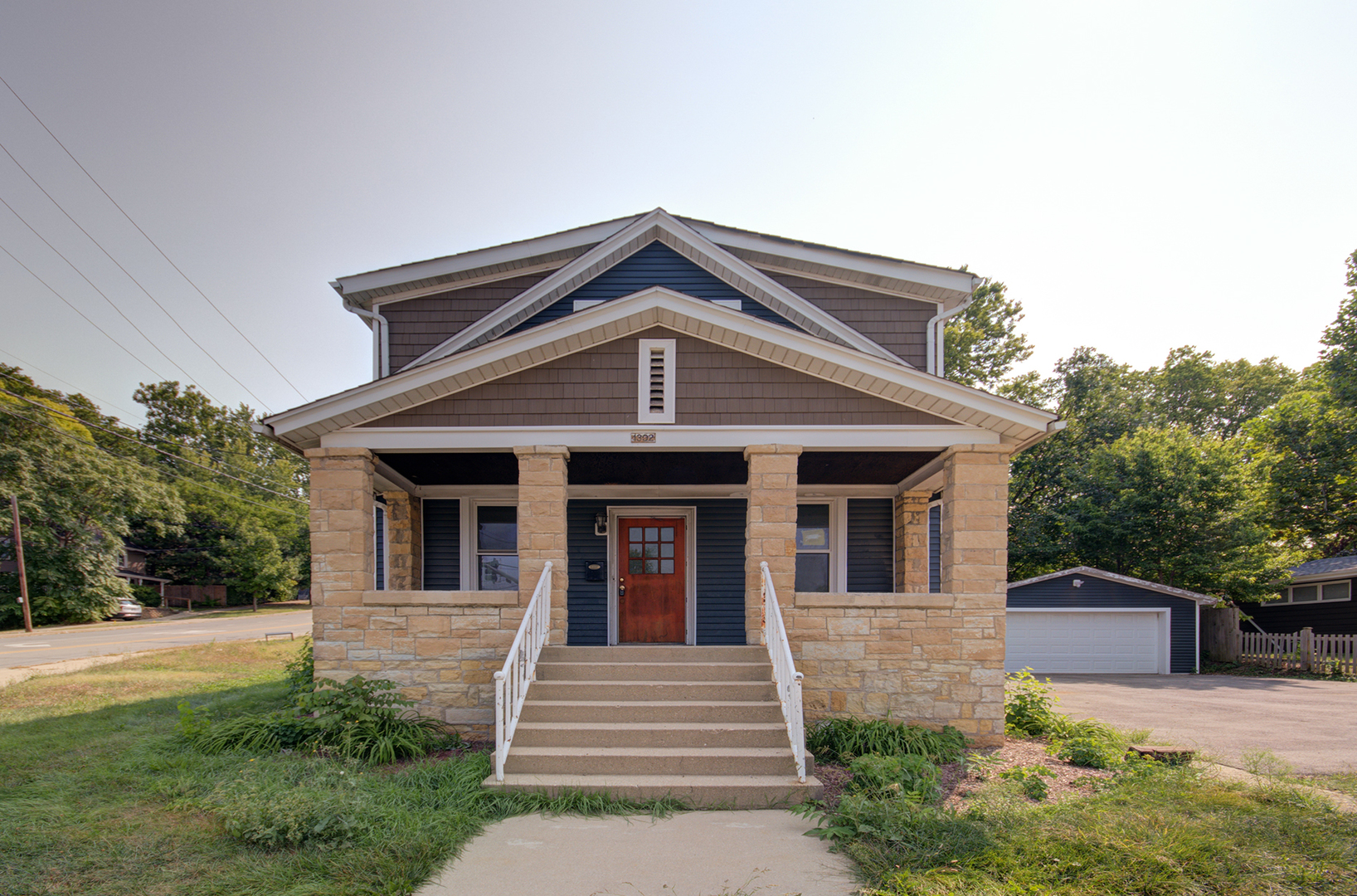 a front view of a house with garden