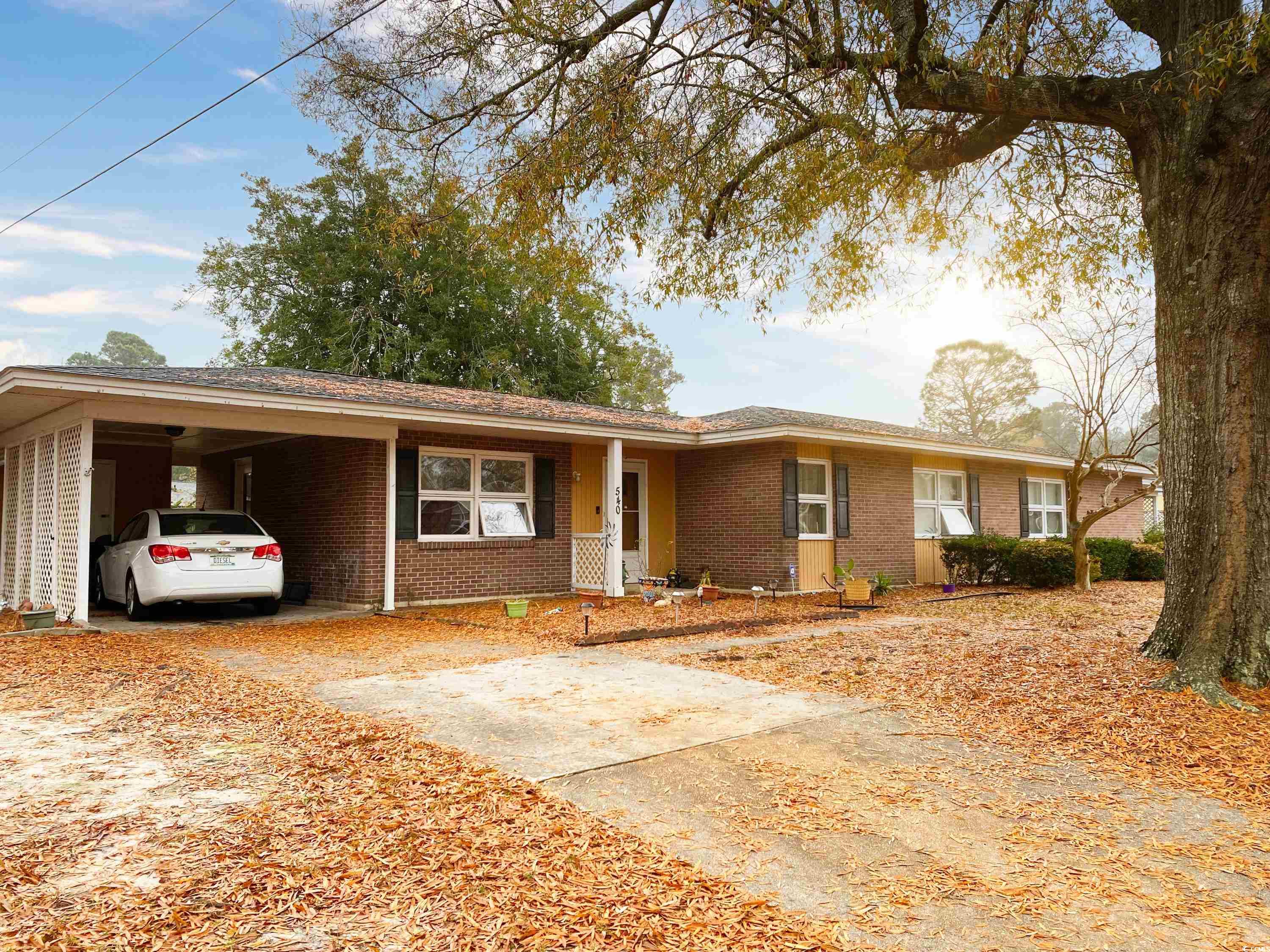 Ranch-style house with a carport