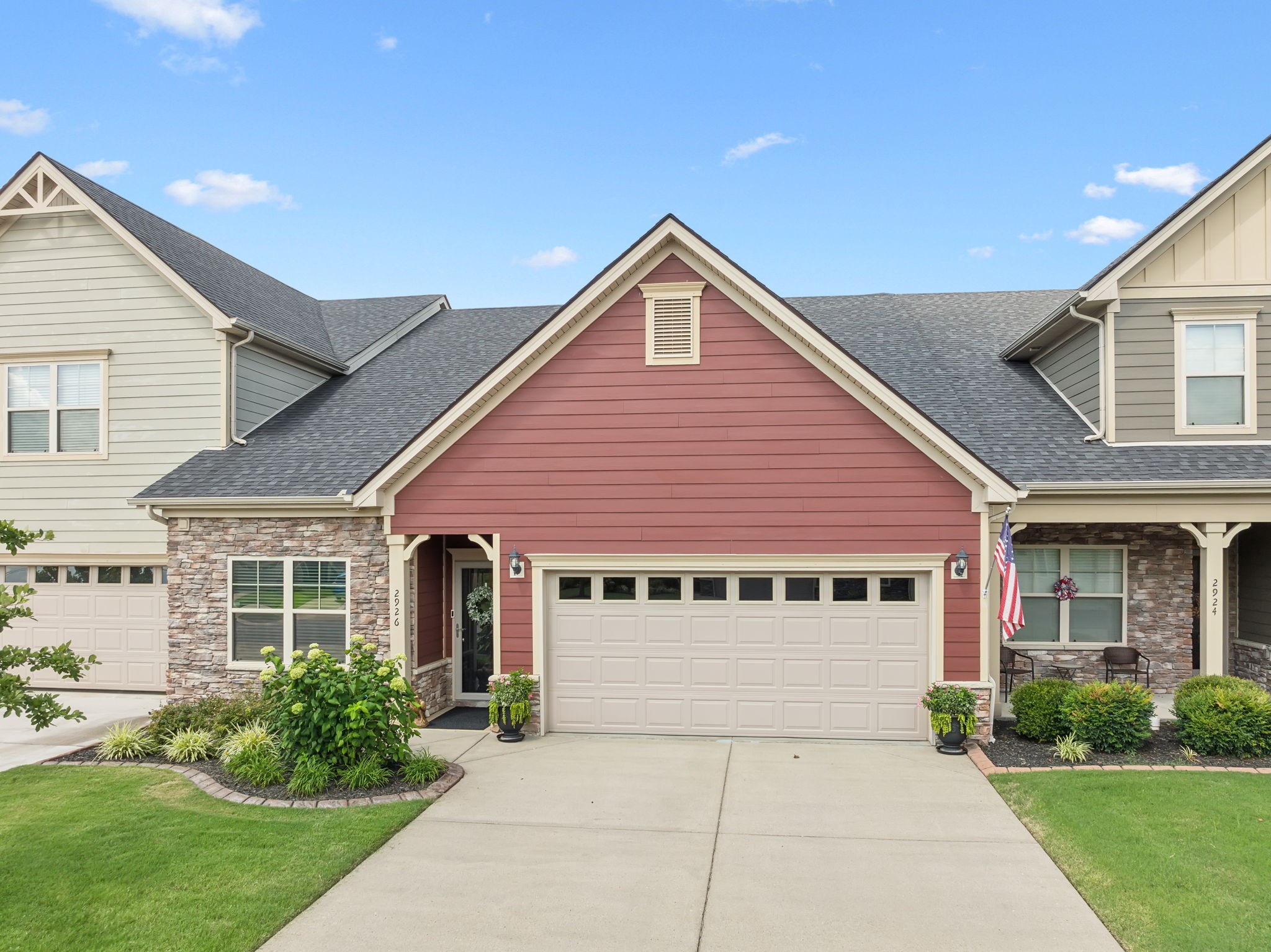 a front view of a house with garden