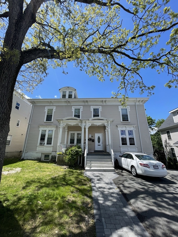 a front view of a house with a yard