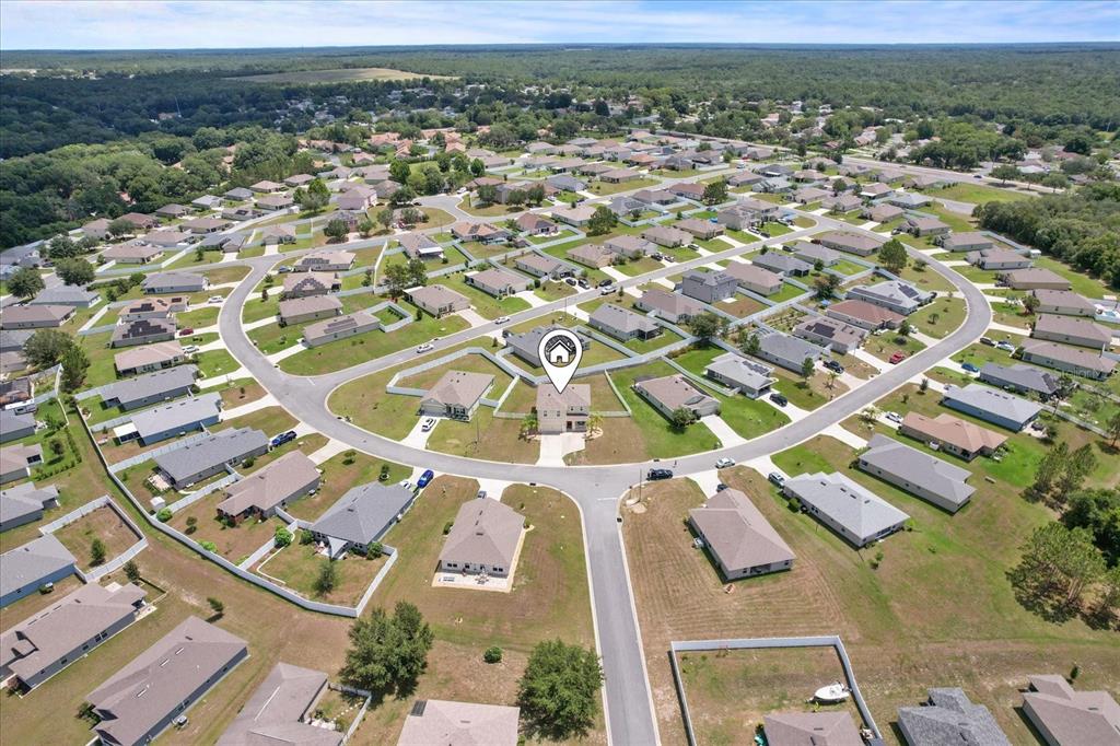 an aerial view of residential houses with outdoor space