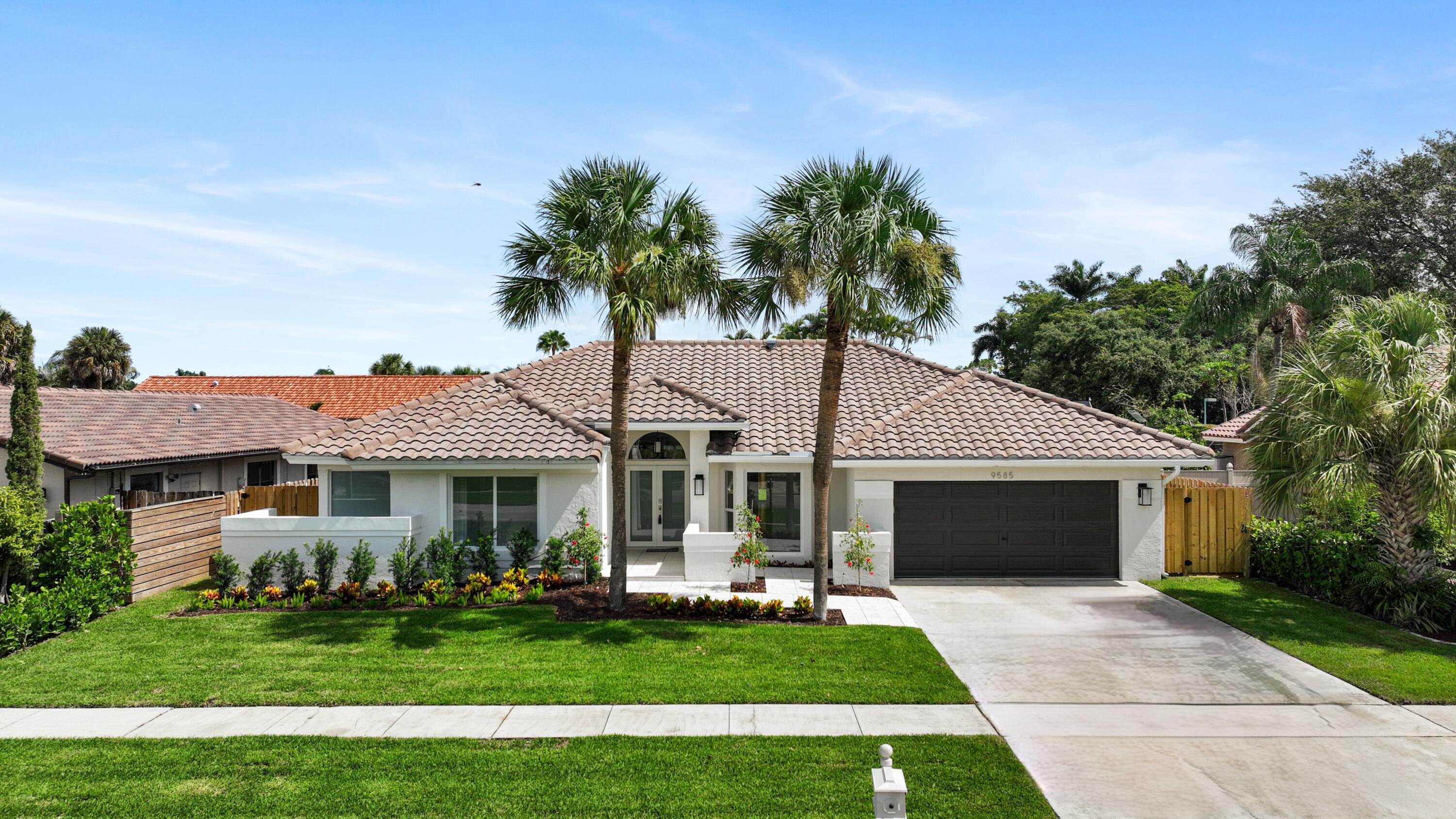 a front view of a house with a garden and porch