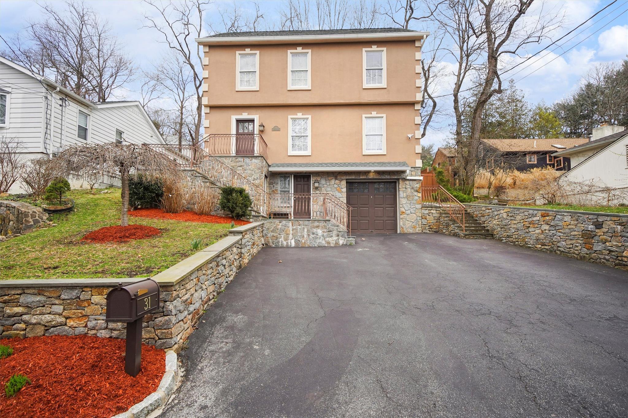 View of property with a garage