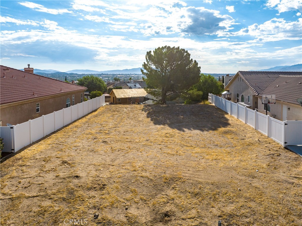 a view of a backyard of the house