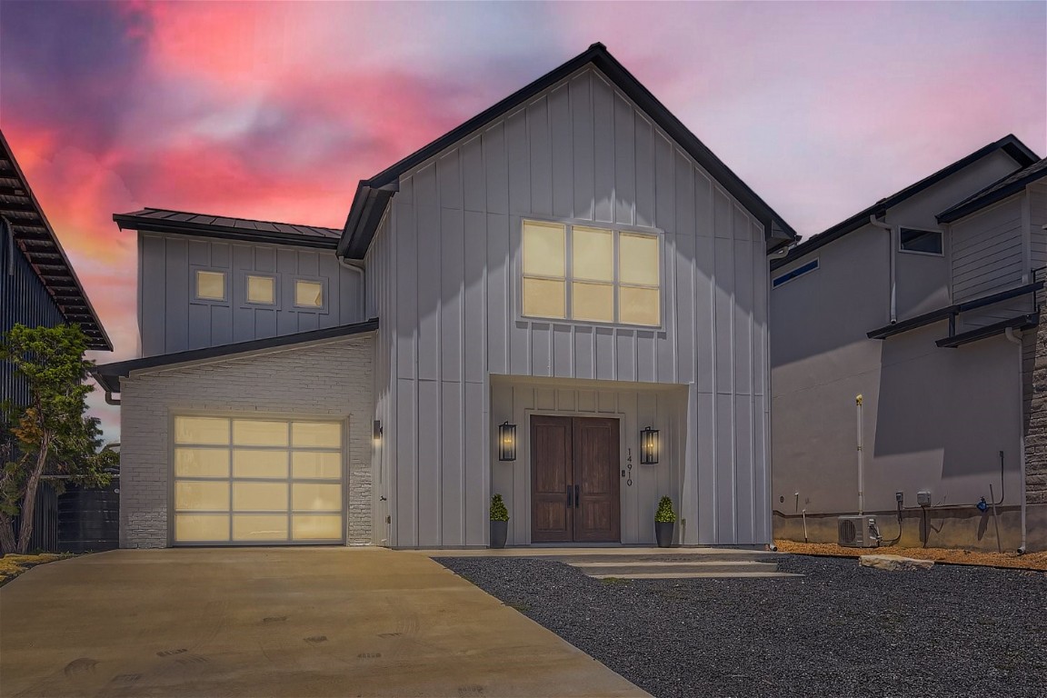 a front view of a house with a garage