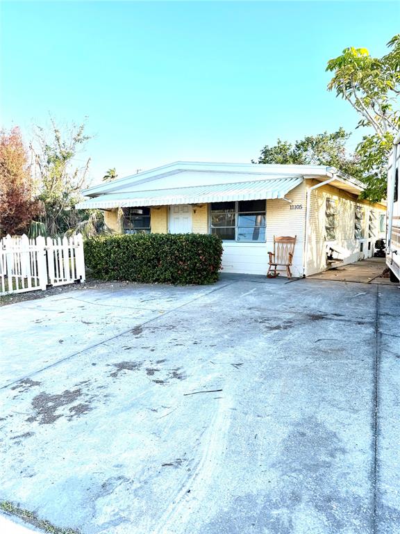 a view of a house with a yard and garage